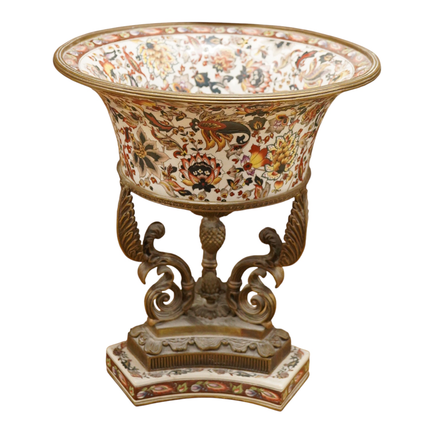 An early 20th century enamelled porcelain and ormolu mounted centrepiece with tripod scroll base, 41cm high